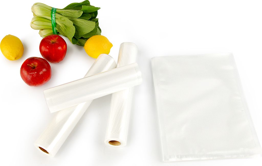 A collection of food items and rolls of plastic wrap on a white background.
