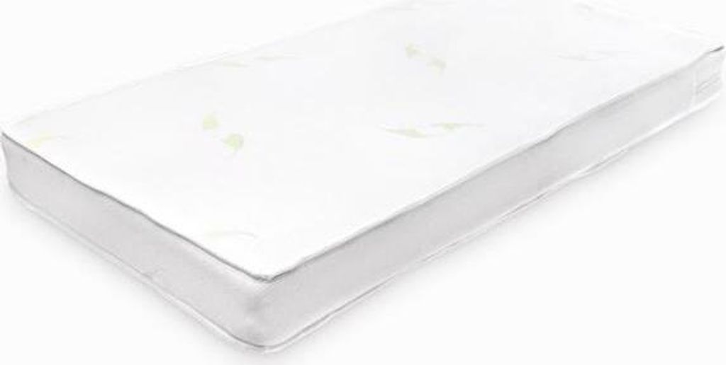 A white baby mattress on a white background.