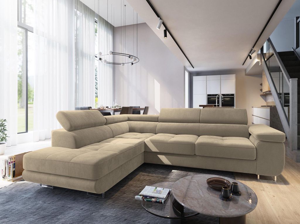 A modern living room with a large sectional sofa, dining area, and kitchen in the background.