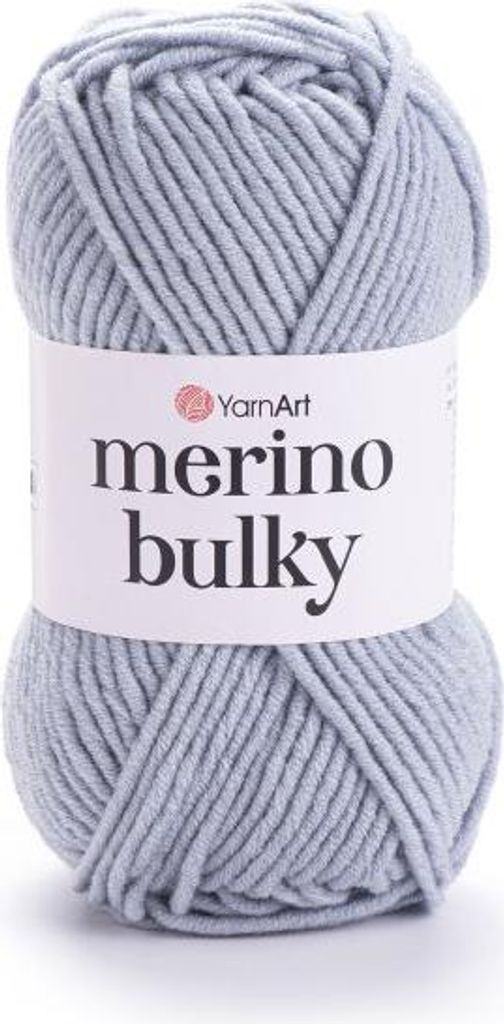 A ball of light gray yarn with a white label.