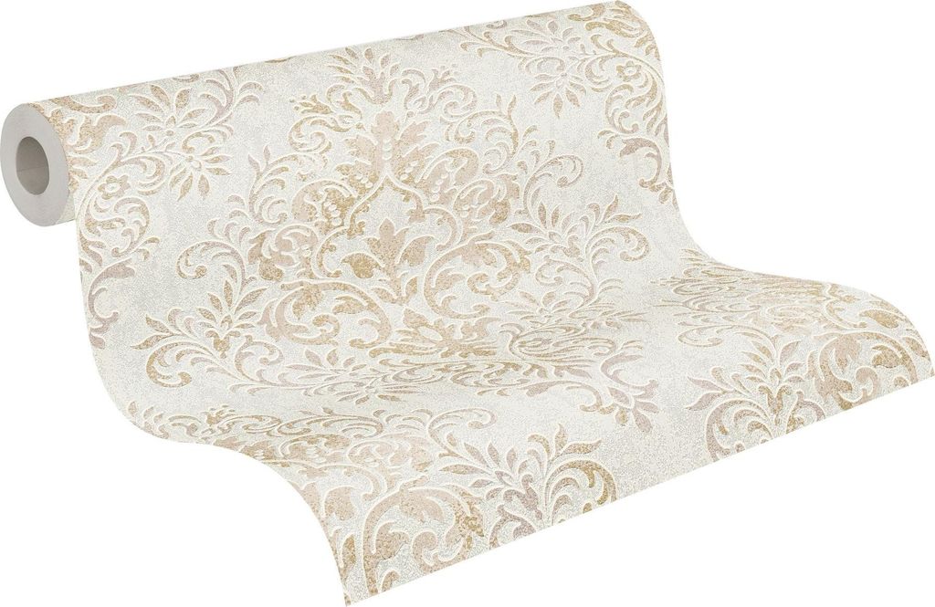 A roll of wallpaper with a damask pattern.