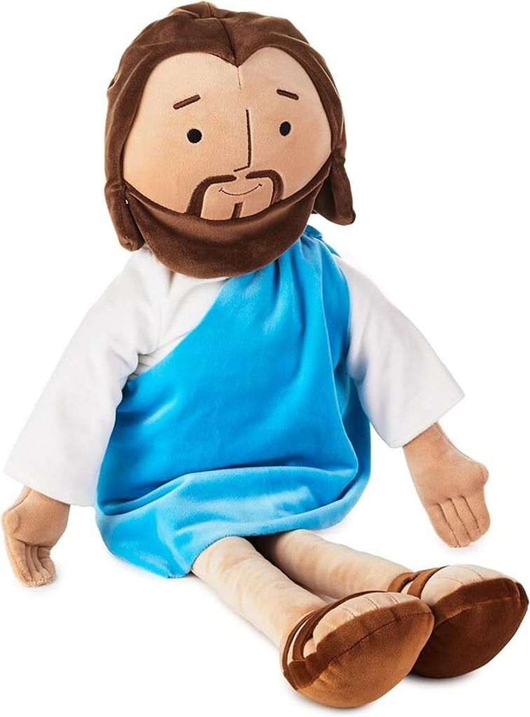 A plush toy of Jesus sitting down.