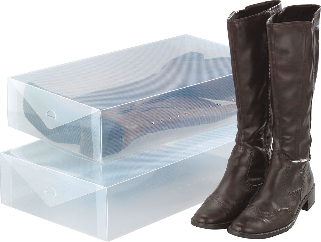 Two clear plastic boot storage boxes are stacked, with a pair of brown leather boots placed next to them.