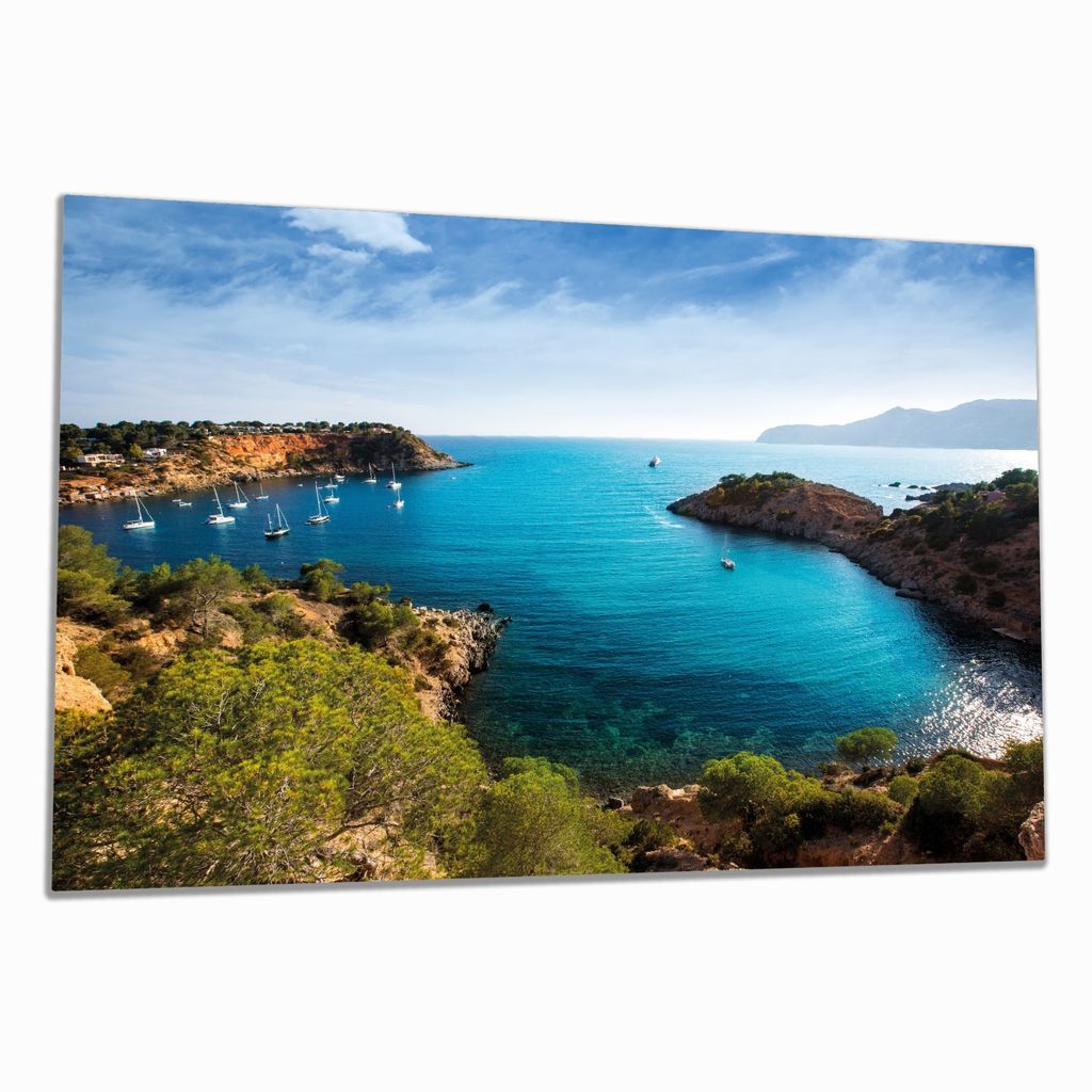 Wallario Herdabdeckplatte aus Glas, Größe 80 x 52 cm 1-teilig, Motiv Ibiza - Blick von einer Bucht aufs Meer