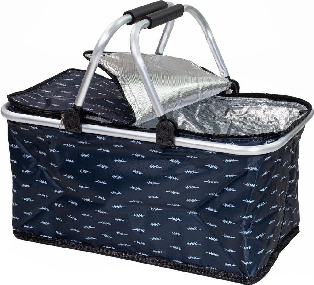 A close-up, studio shot of an open, foldable picnic basket with a silver insulated interior and a navy blue exterior with a white feather pattern. The basket has a silver metal frame and black handles.