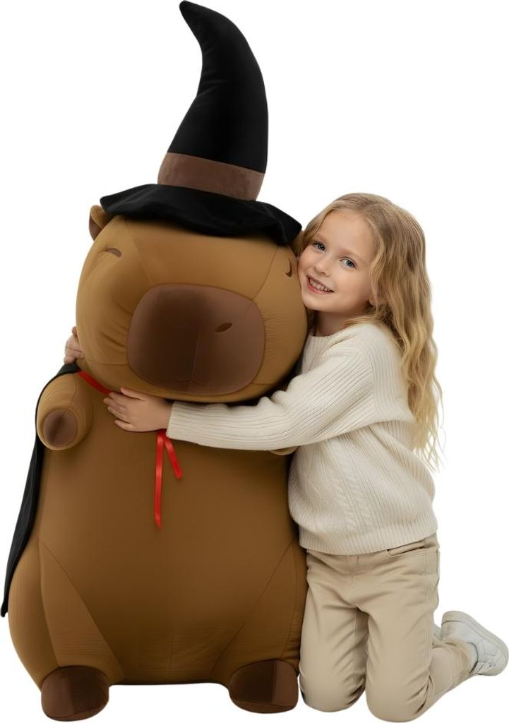 A young girl is hugging a large stuffed capybara wearing a wizard hat and cape.