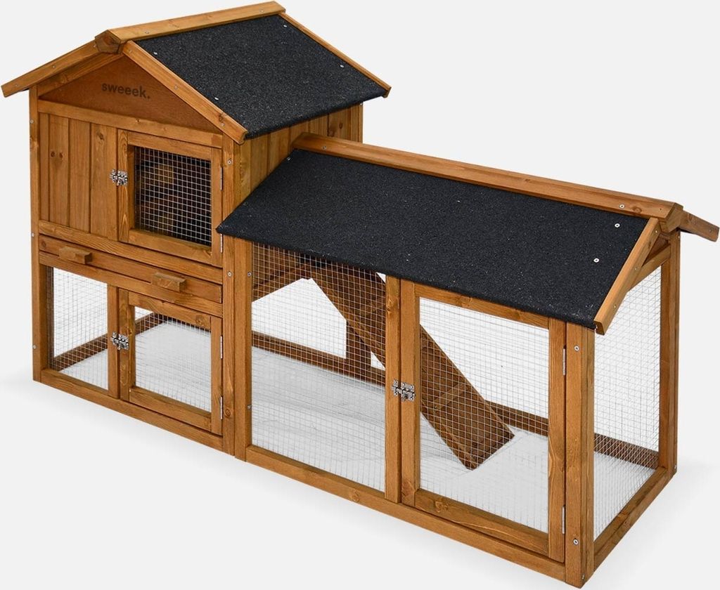 A wooden rabbit hutch with a black roof, shown against a white background.