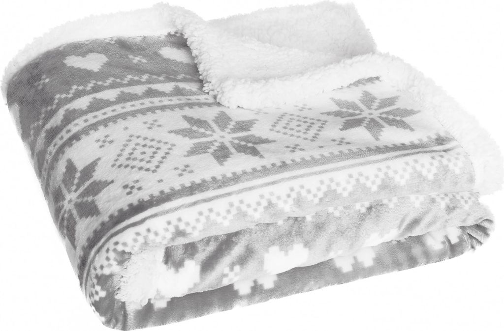 A folded blanket with a Christmas pattern.