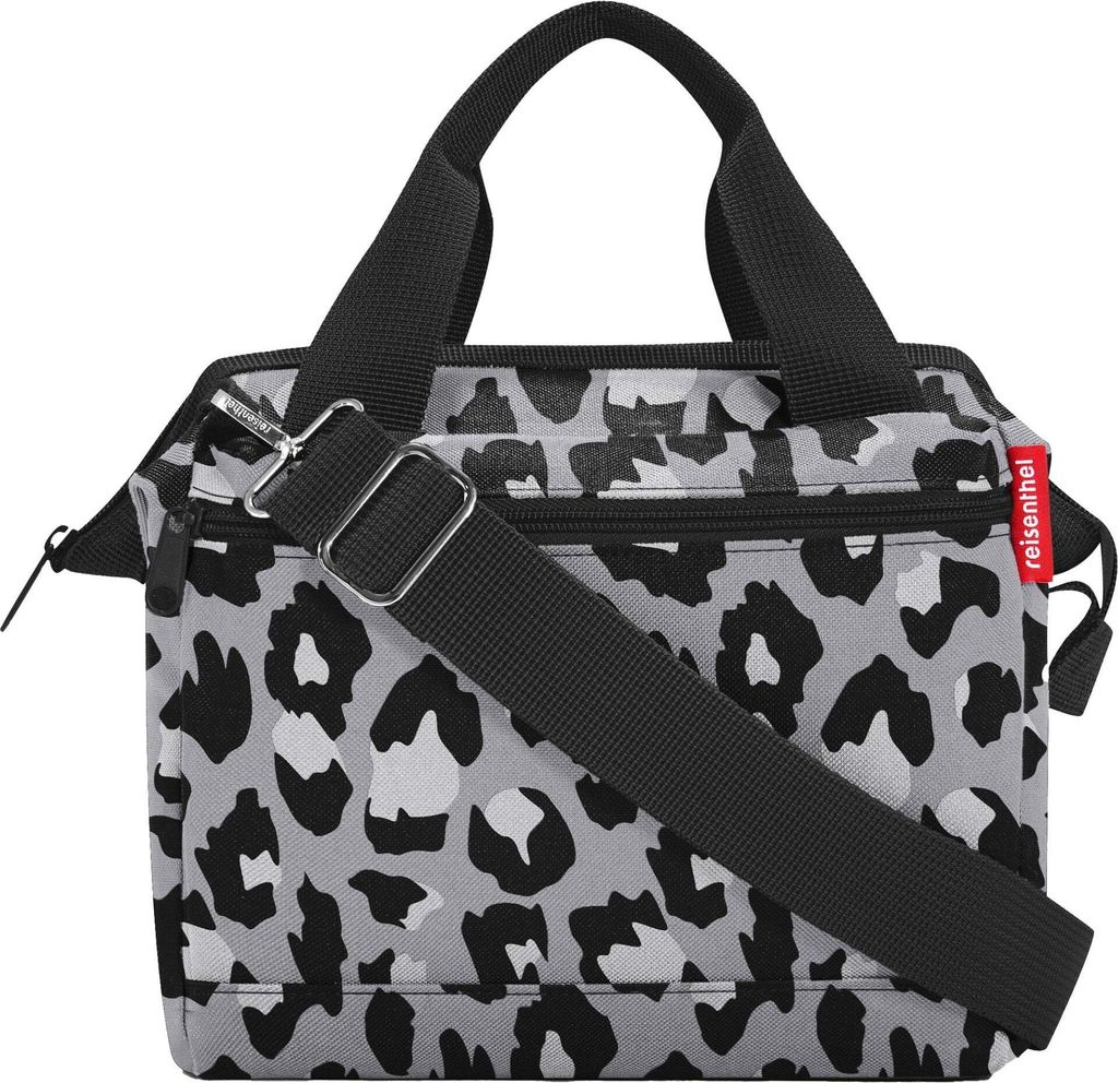 A leopard print handbag with a shoulder strap against a white background.