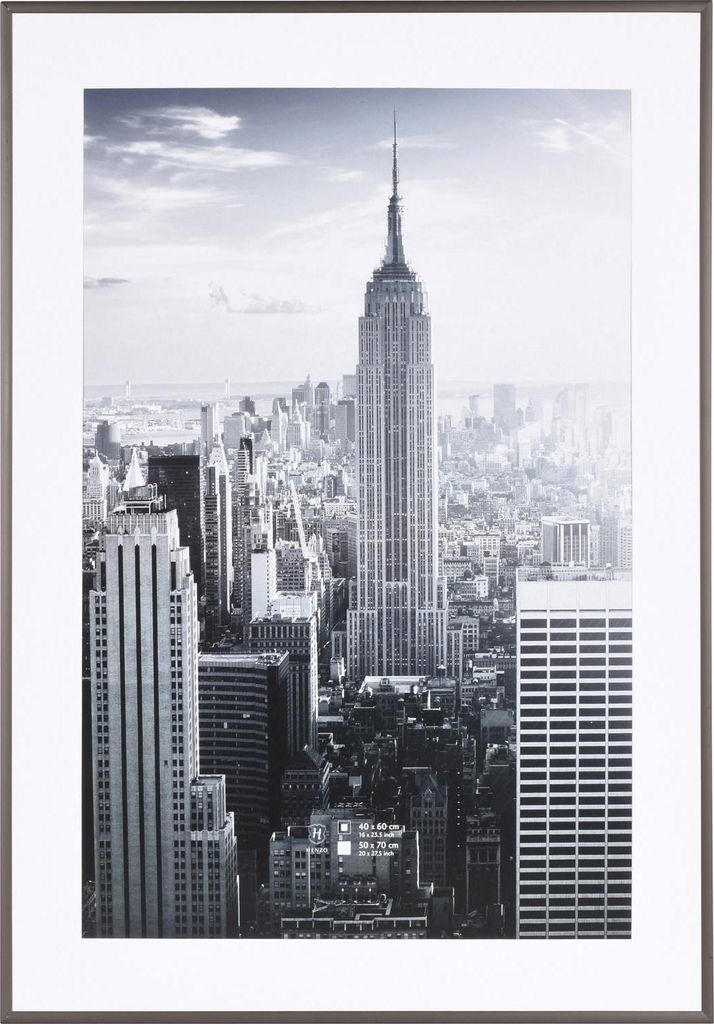 A framed black and white photograph of the Empire State Building and surrounding New York City skyline.