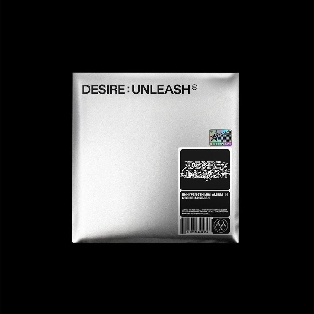 A silver album cover with black text and a sticker.