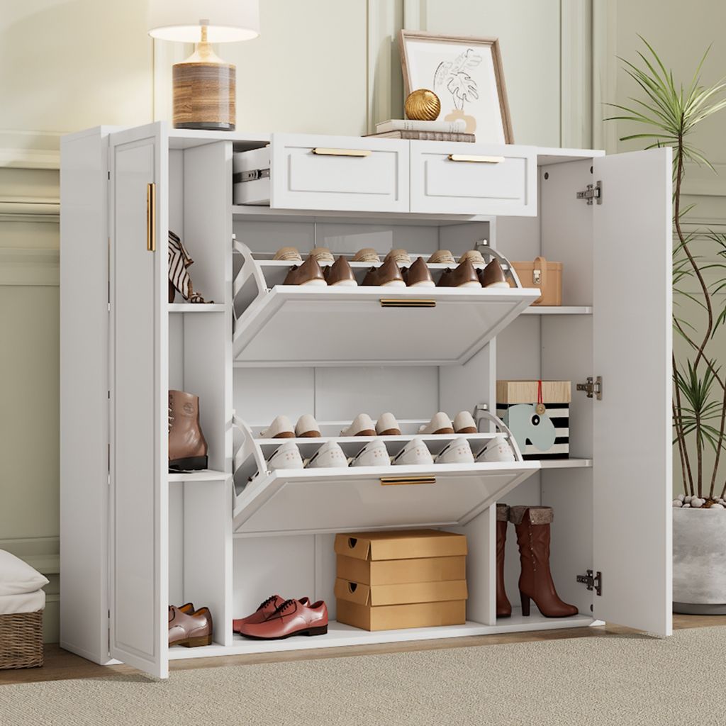 A white shoe cabinet with multiple shelves and drawers, filled with shoes and some decorative items, placed in a room.