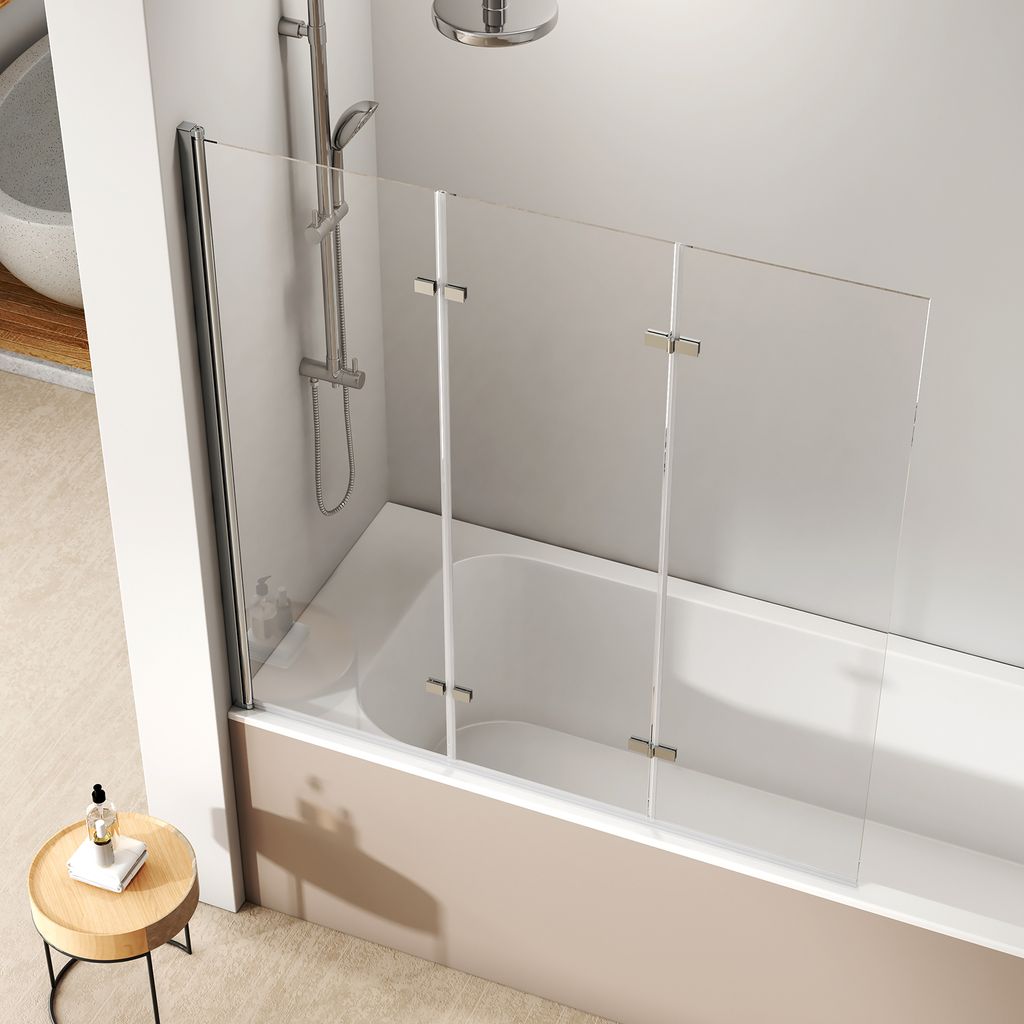 A modern bathroom with a bathtub and a glass shower screen.
