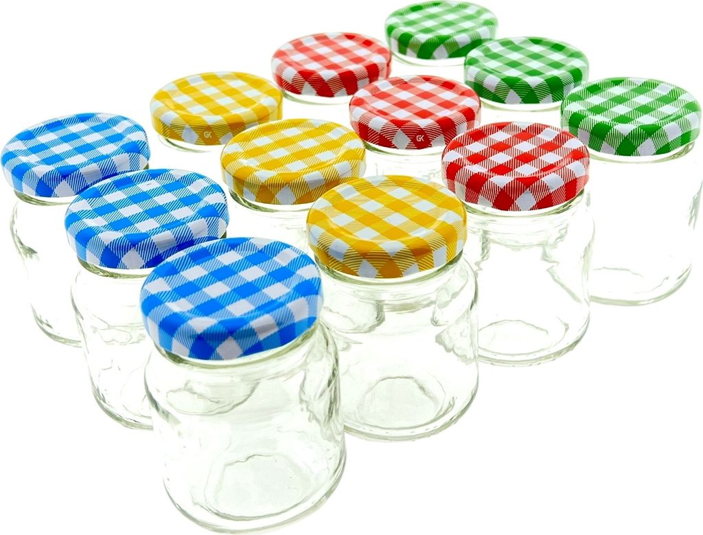 A collection of small glass jars with checkered lids in various colors.