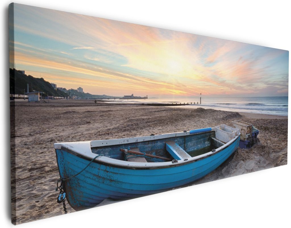 Wallario Premium Leinwandbild Fischerboot am Strand bei Sonnenuntergang in Größe 60 x 150 cm