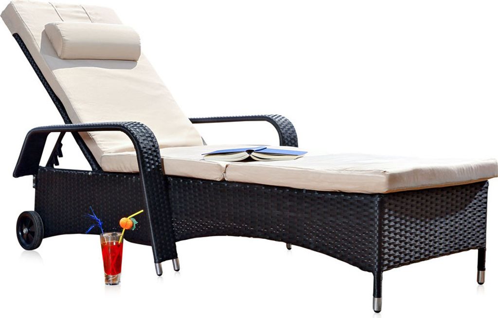 A black rattan chaise lounge with beige cushions, a pillow, and a drink on a white background.