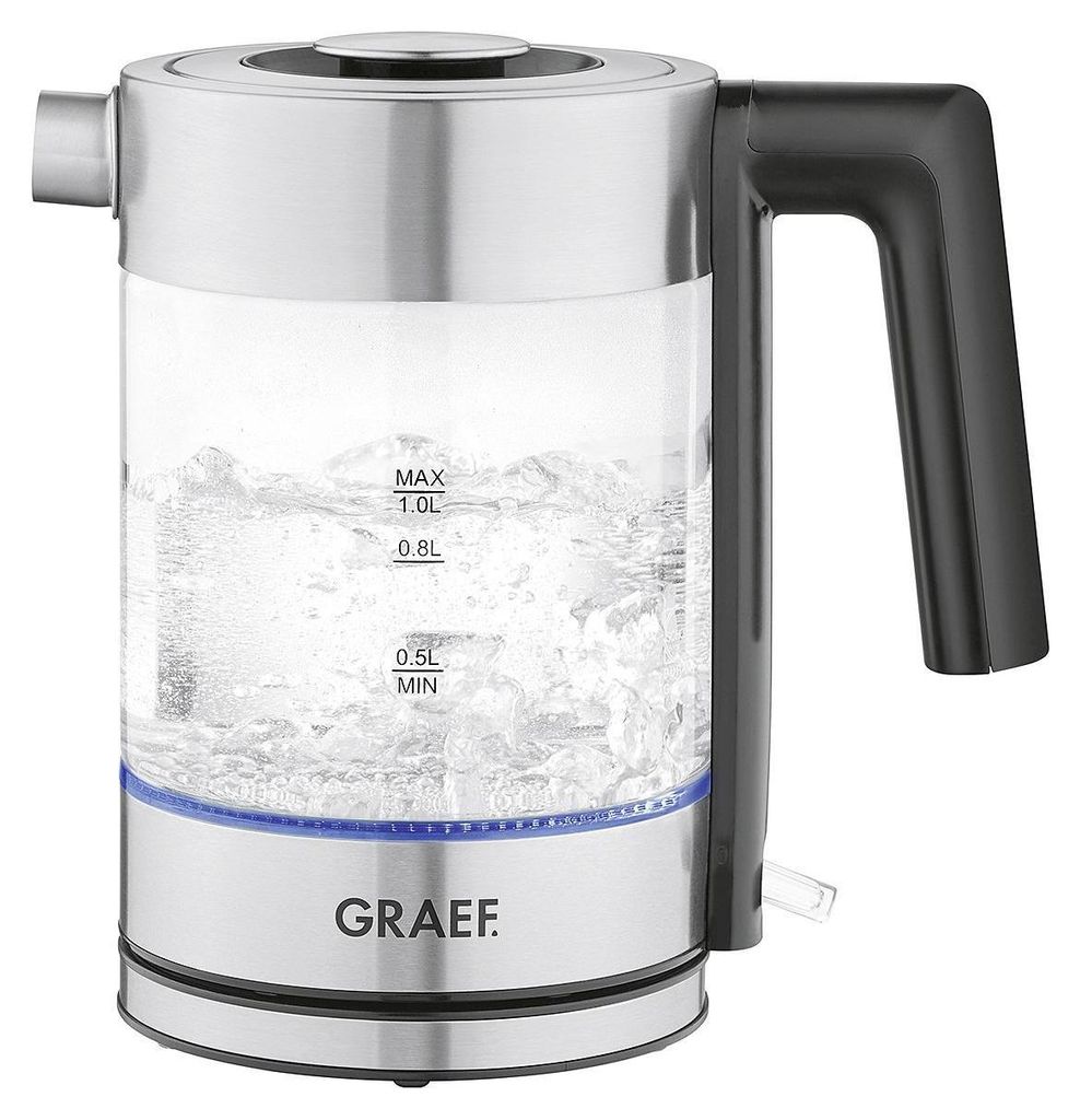 A glass electric kettle with water boiling inside, sitting on a white background.
