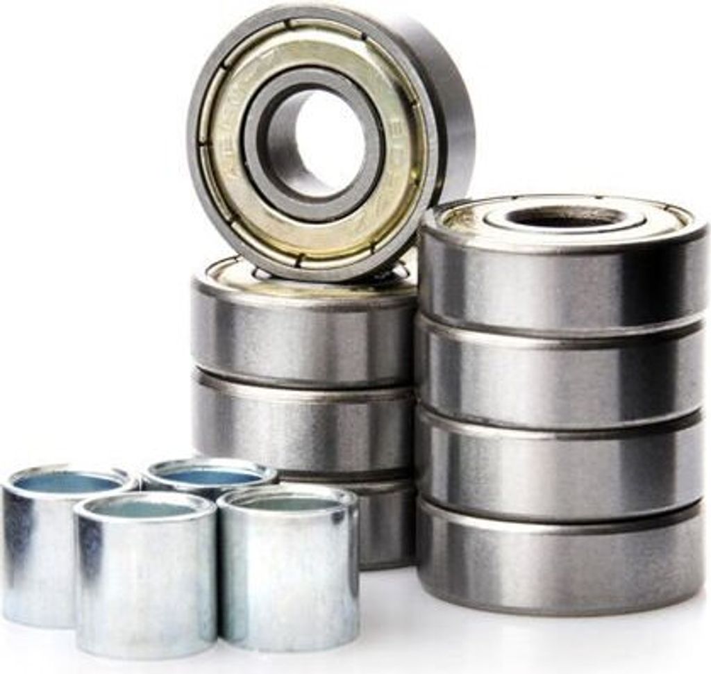 A collection of ball bearings stacked and arranged on a white background.
