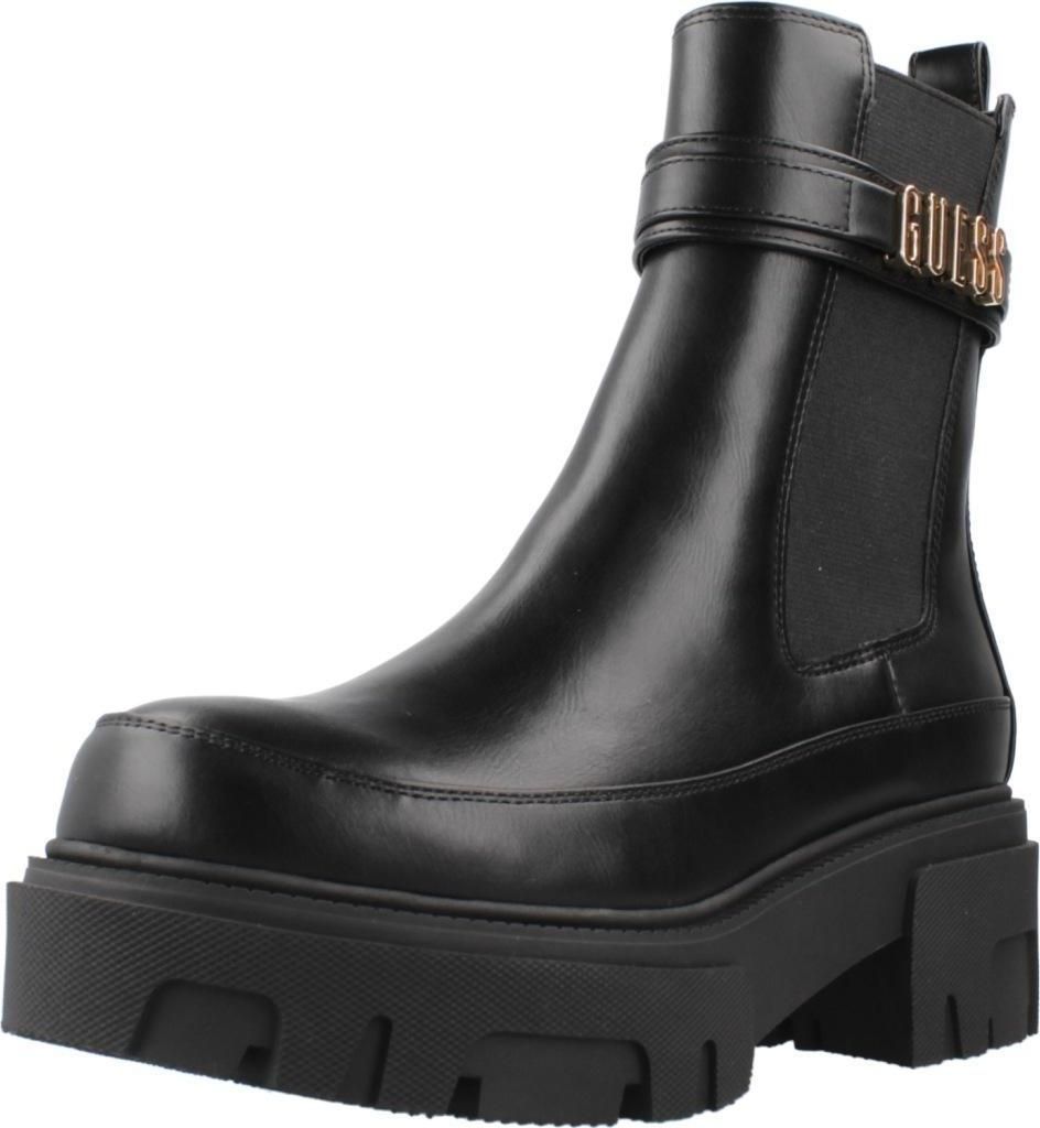 A black Guess Chelsea boot with a platform sole and gold buckle detail.