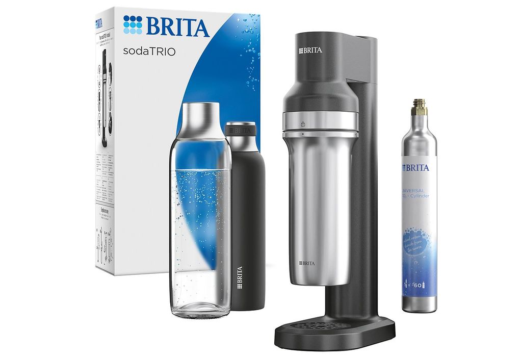 A Brita sodaTRIO water carbonator set is displayed against a white background, including the carbonator machine, two bottles, a CO2 cylinder, and the product packaging.