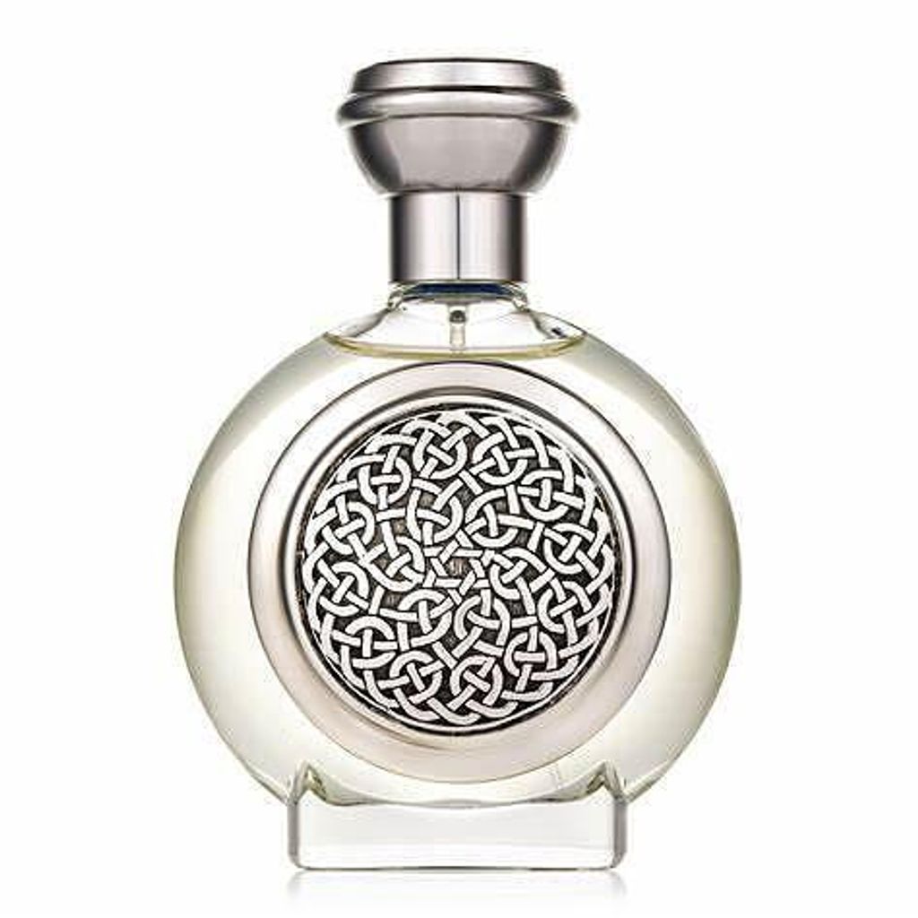 A clear, professional studio shot of a round perfume bottle with a silver cap and a decorative silver Celtic knot design on the front.