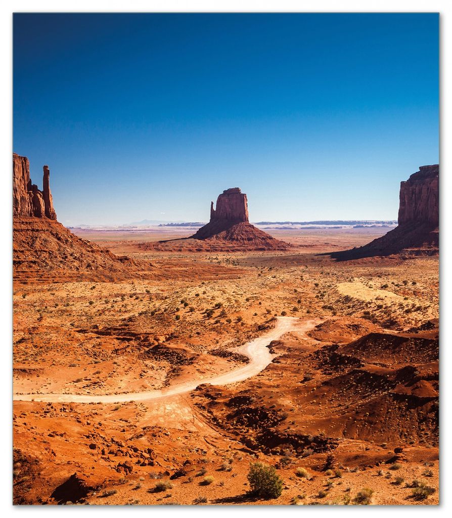 Wallario Herdabdeckplatte aus Glas, Größe 52 x 60 cm 1-teilig, Motiv Monument Valley unter blauem Himmel