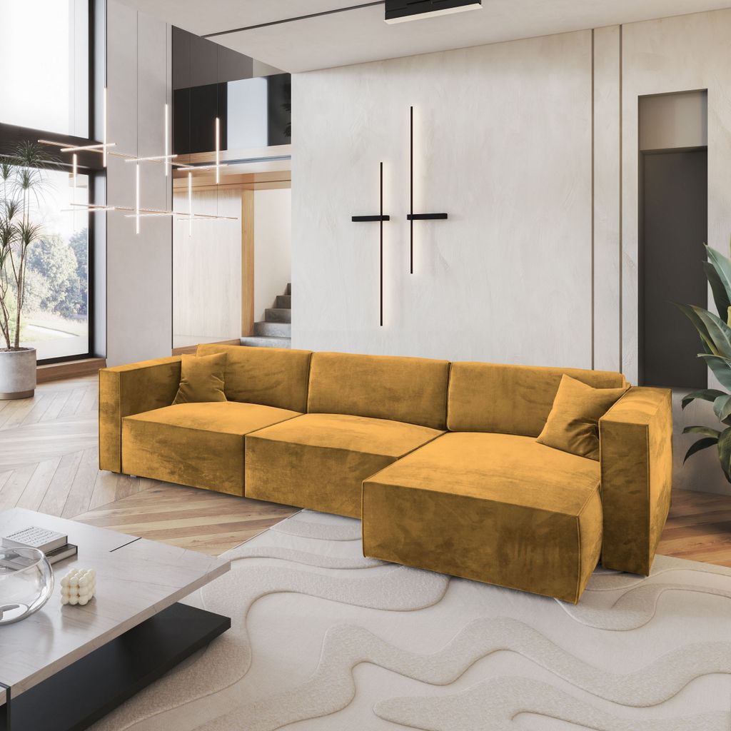 A modern living room with a large sectional sofa, coffee table, and abstract rug.