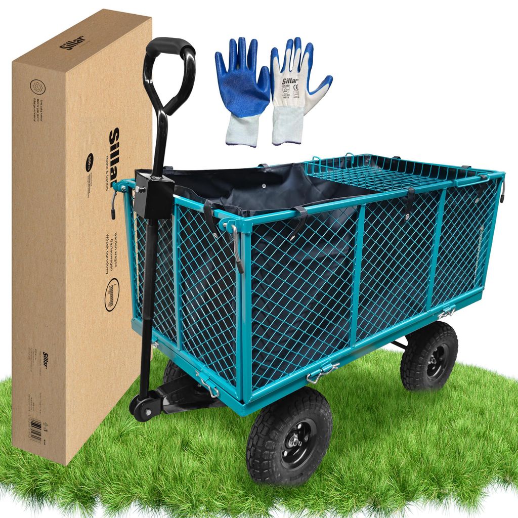 A teal garden wagon with a black liner and handle, a cardboard box, and a pair of gloves, all placed on a patch of green grass.