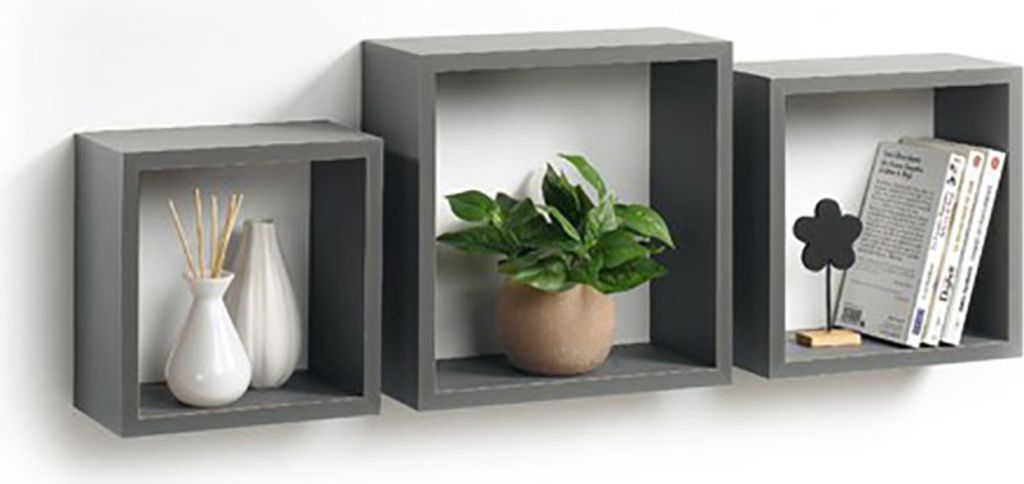Three grey cube-shaped wall shelves mounted on a white wall, each displaying decorative items.