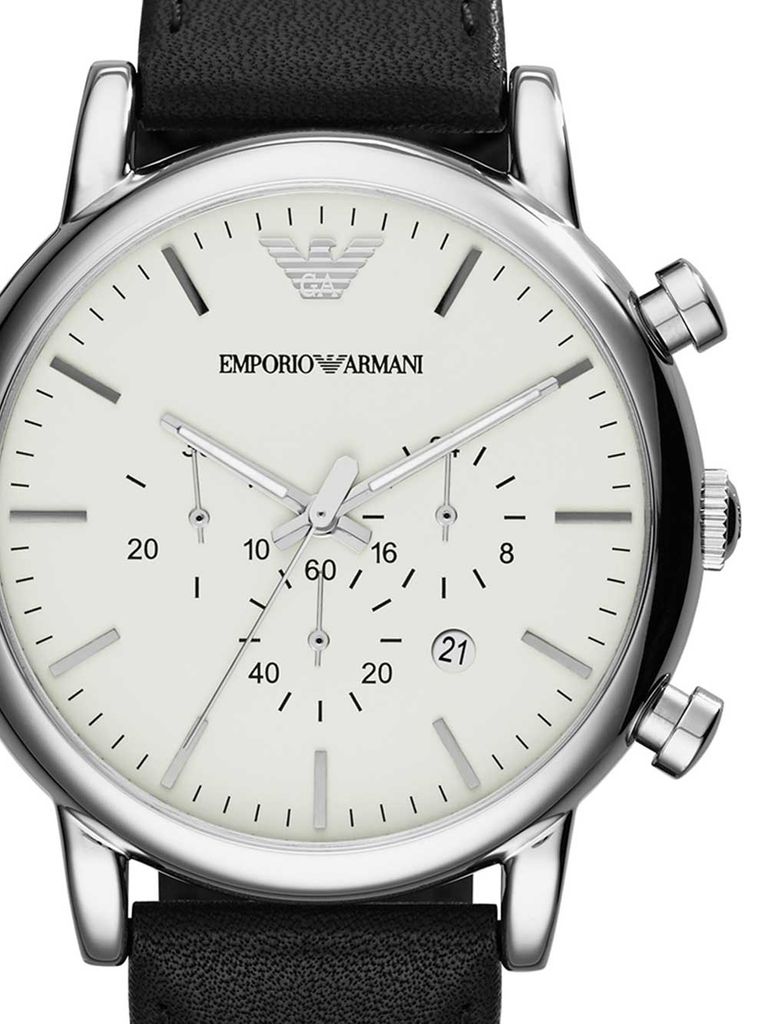 A close-up, front-facing view of an Emporio Armani watch with a white dial and a black leather strap.