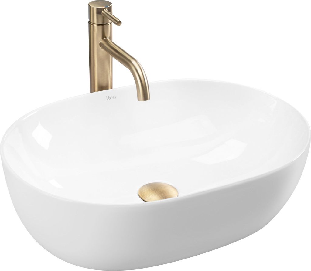 A white oval countertop sink with a gold faucet and drain.