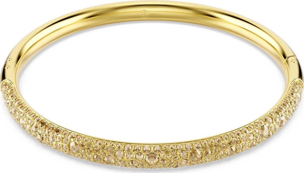 A close-up studio shot of a gold-colored bracelet with small stones embedded in it.