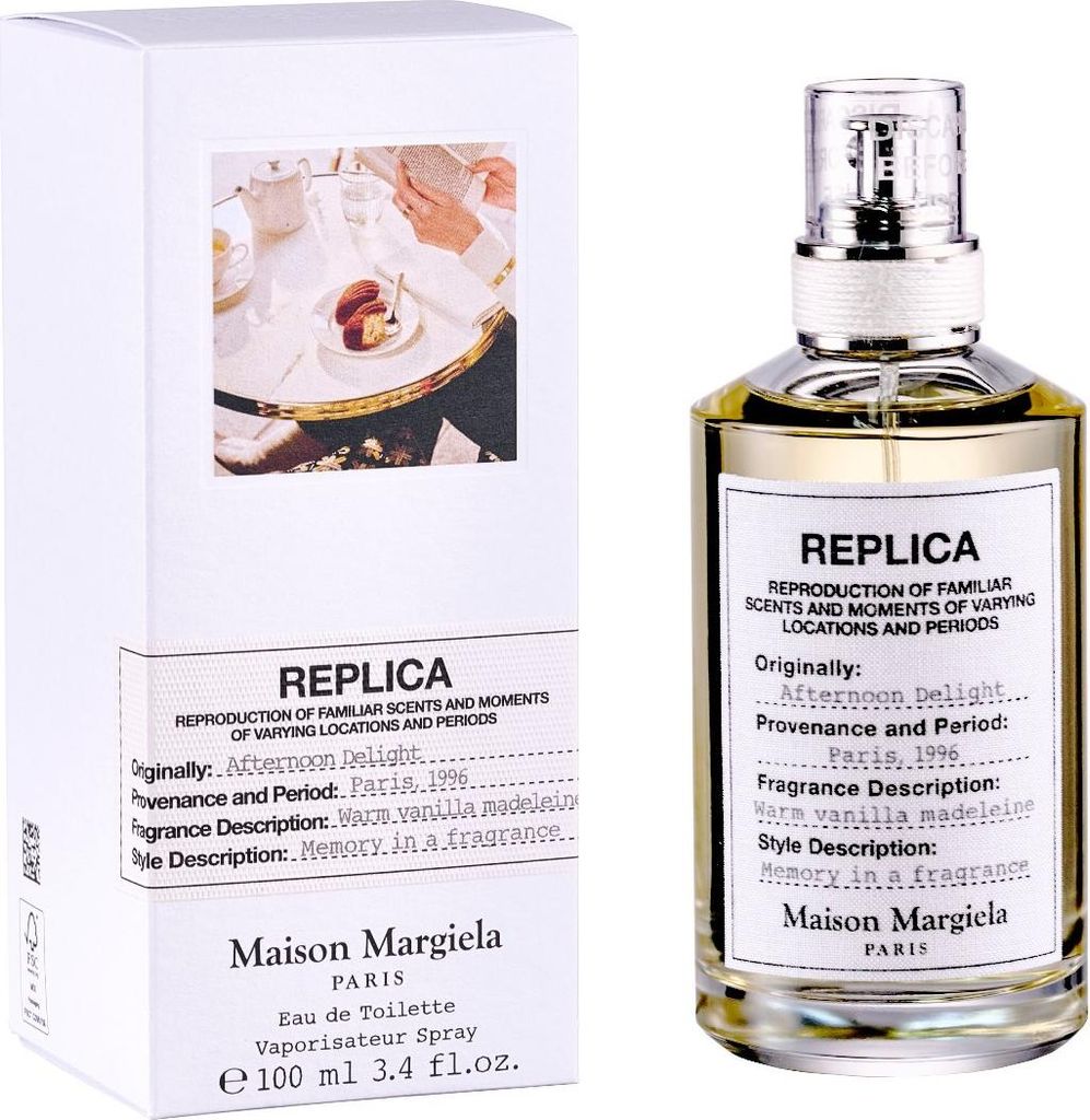 A perfume bottle and its packaging are displayed against a white background.