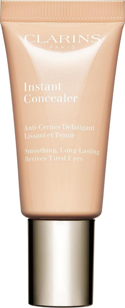 A product shot of a Clarins Instant Concealer tube with a gold cap.