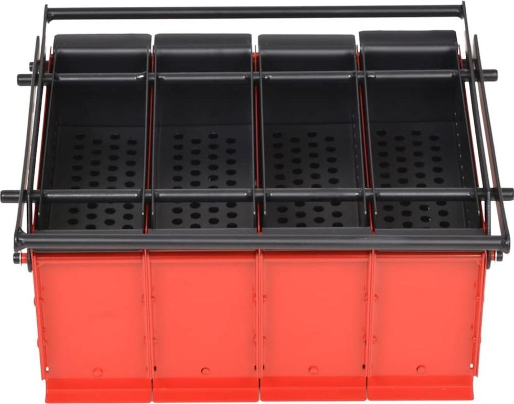 A top-down view of a four-cell paper briquette maker.