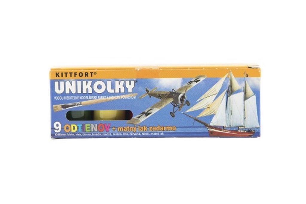A product box for model paints and a model airplane and ship.