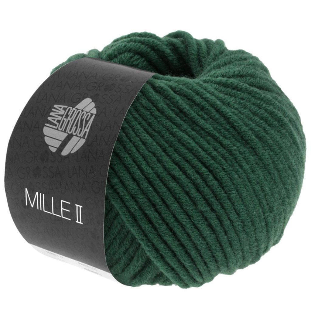 A ball of green yarn with a dark label wrapped around it.