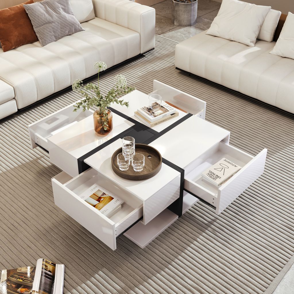 A modern living room with a white sectional sofa and a white coffee table with drawers.