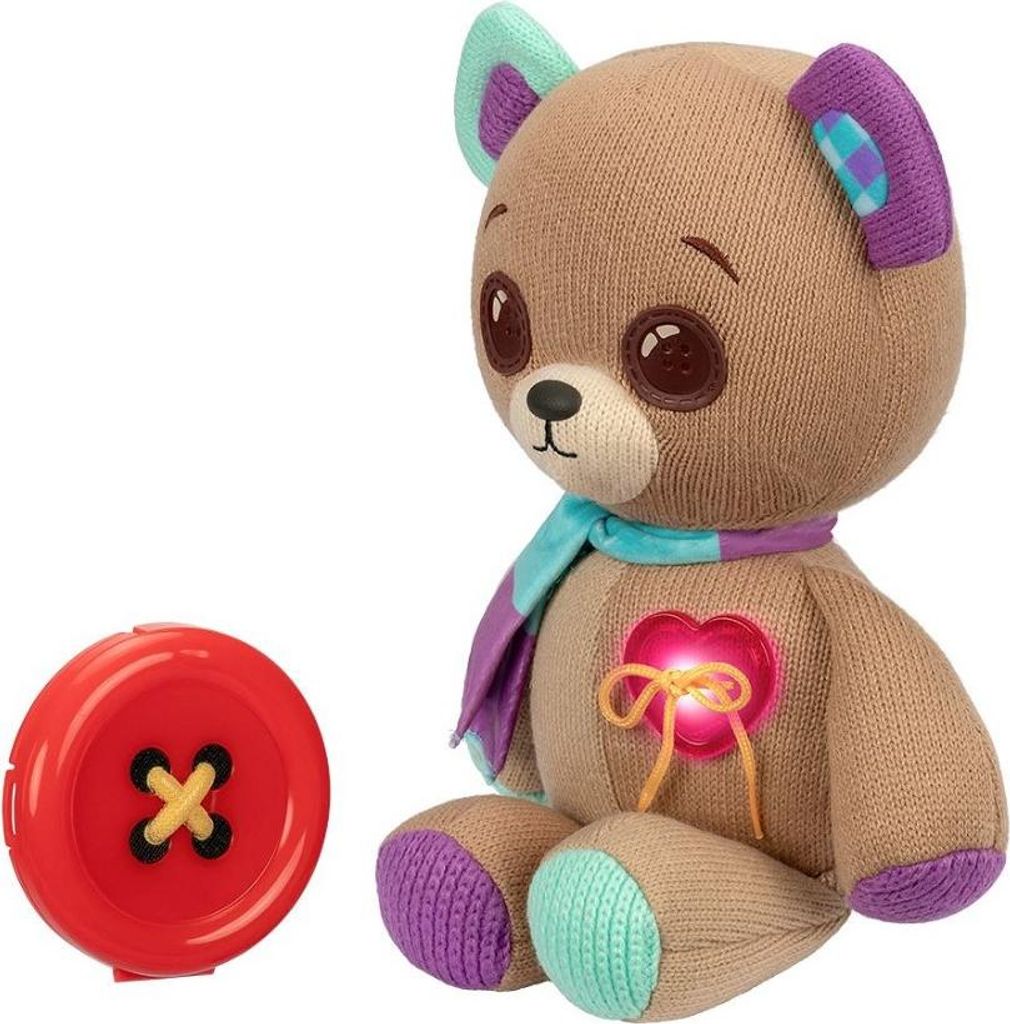 A plush teddy bear with a button accessory.