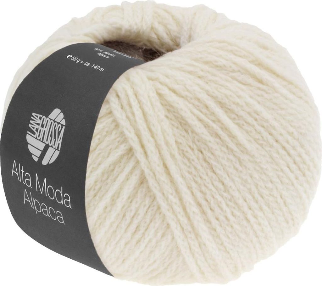 A ball of cream-colored yarn with a dark label wrapped around it.