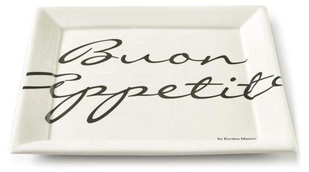 A rectangular white ceramic plate with black script text "Buon Appetito" and a small brand name at the bottom right.