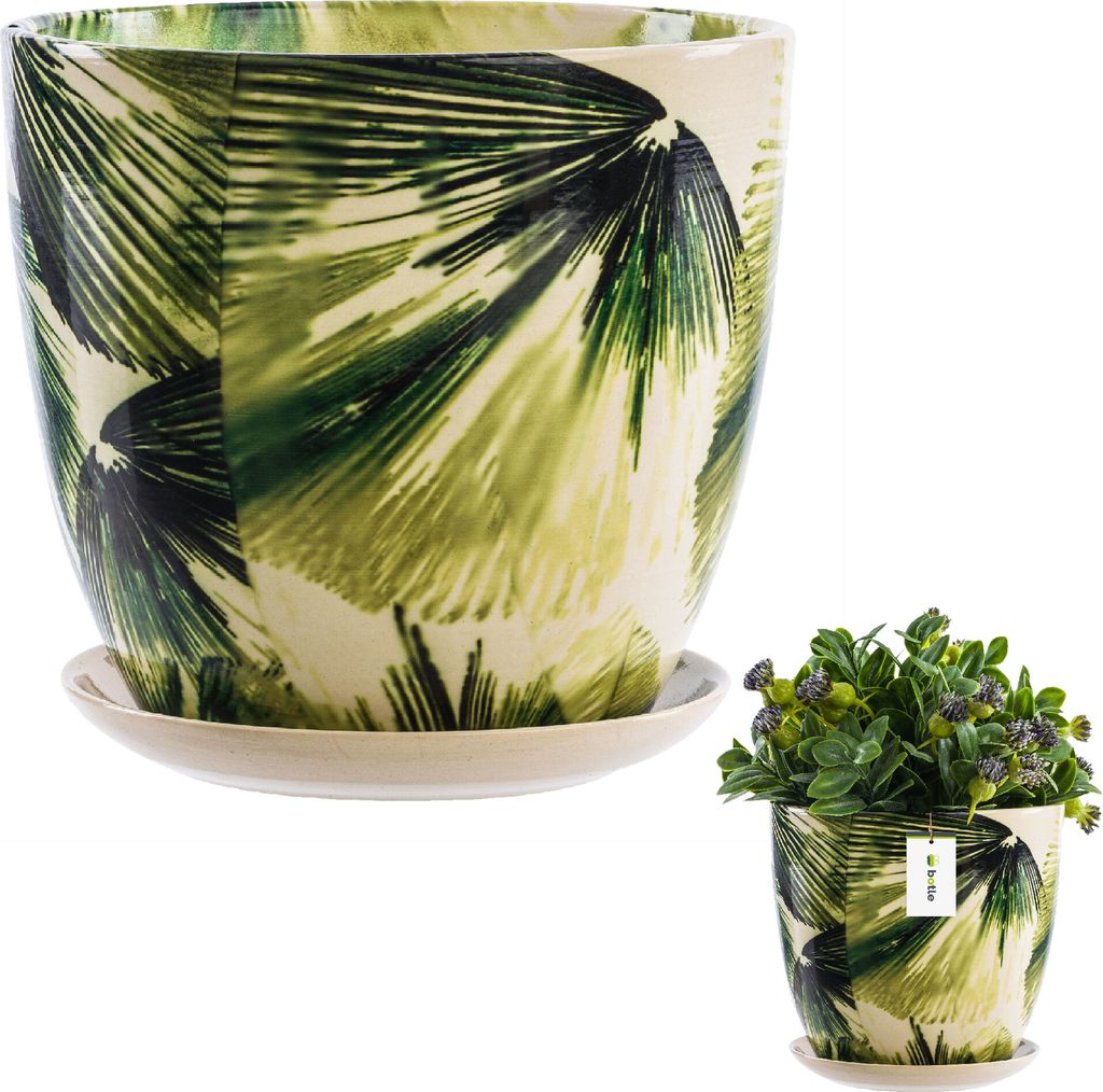 A ceramic pot with a green leaf pattern and a matching saucer, shown with a small plant in a separate, smaller pot.