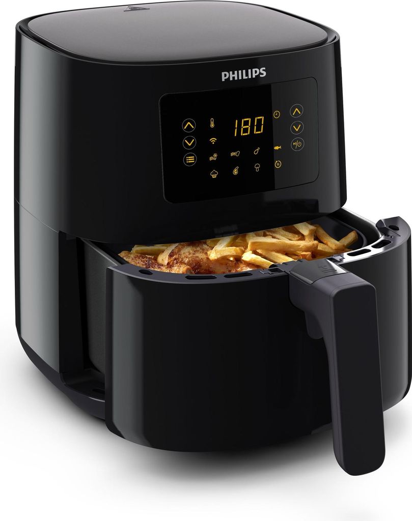A black Philips air fryer with a basket full of french fries.