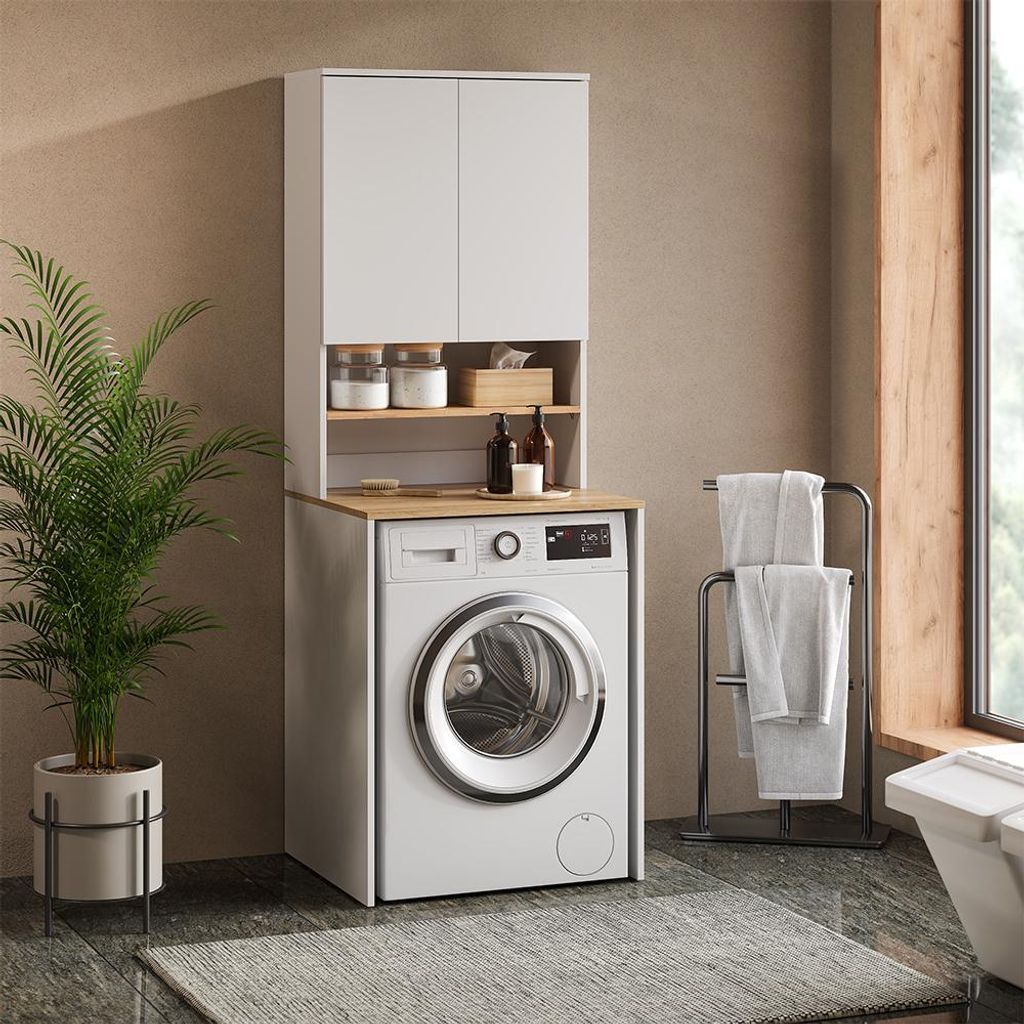 A laundry room scene with a washing machine and a cabinet above it.