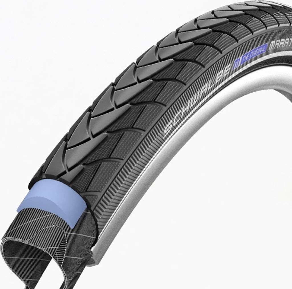 A close-up, cutaway view of a bicycle tire, showing its internal structure and tread pattern.