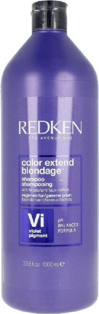A full shot of a purple shampoo bottle.