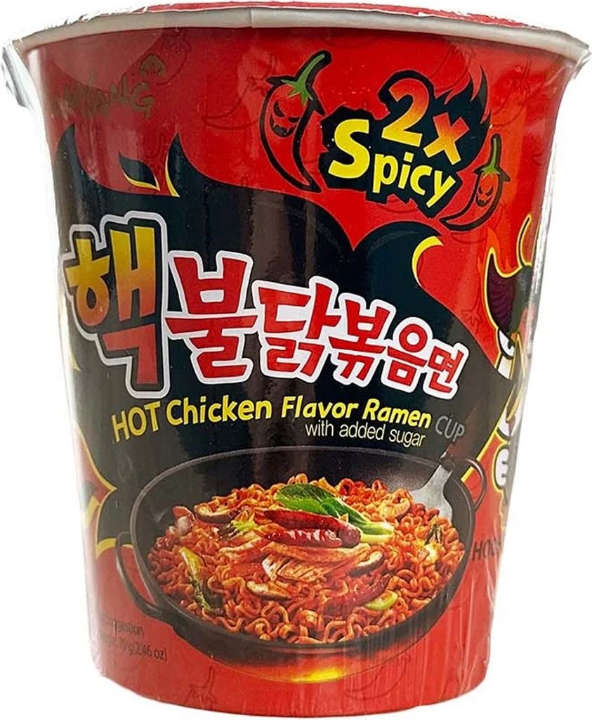 A close-up of a cup of Samyang Buldak Ramyun 2x Spicy instant noodles.