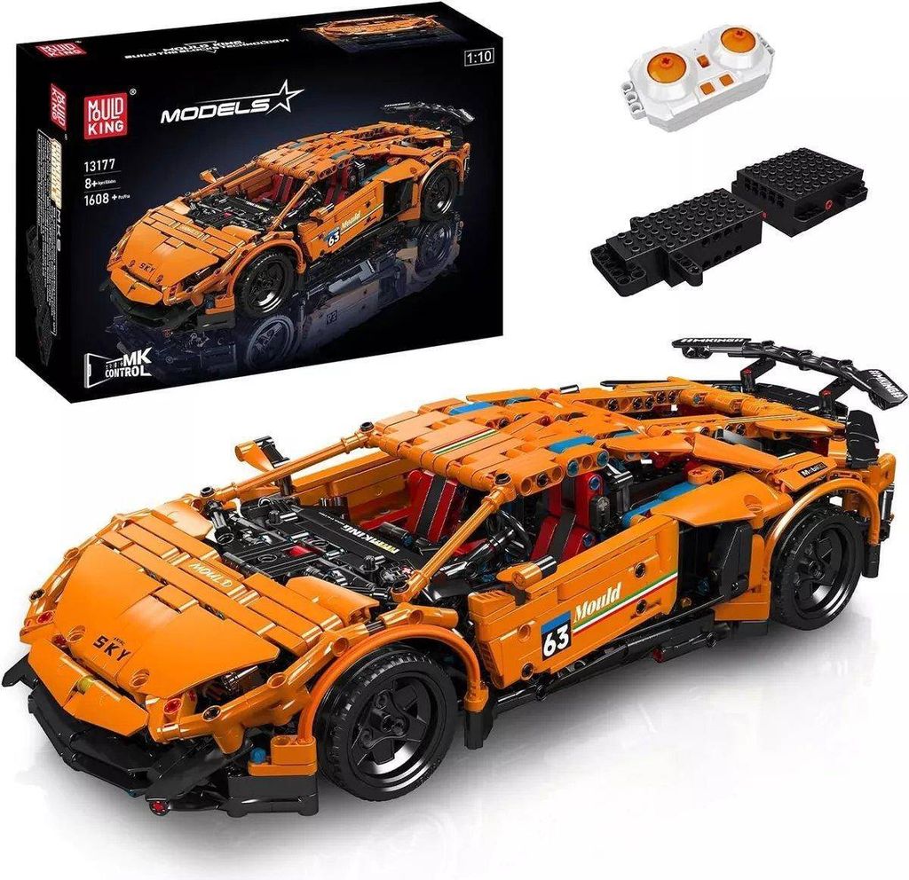 An orange remote-controlled car model kit and its accessories are displayed on a white background.