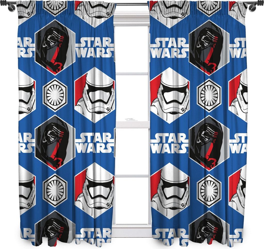 A pair of Star Wars themed curtains hanging in front of a window.