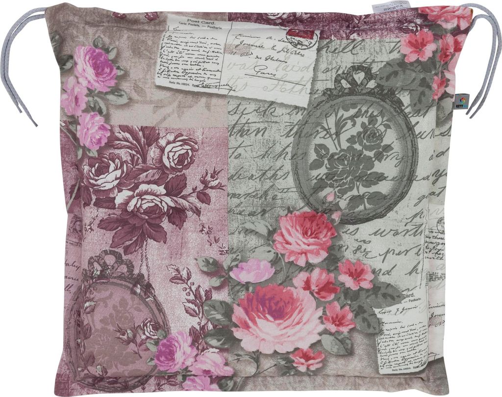 A square cushion with a floral and postcard-like print.